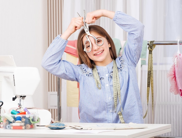 Young tailor with scissors