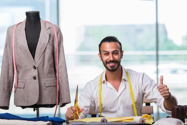 Young tailor working on new clothing design