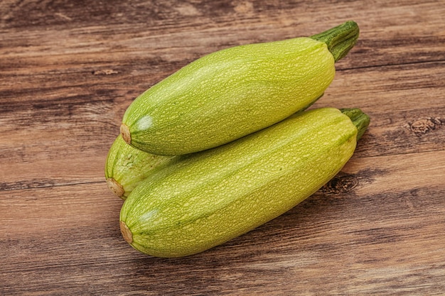 Young tasty zucchini over board