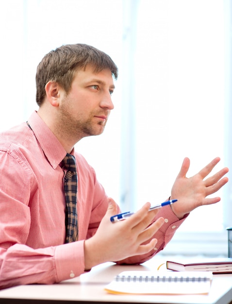 Young teacher in the office