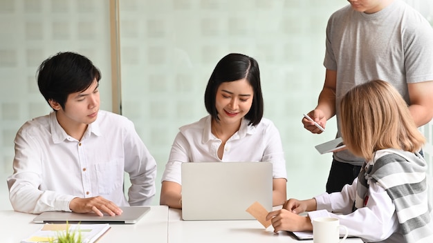 Young team of business meeting with laptop in office workplace.