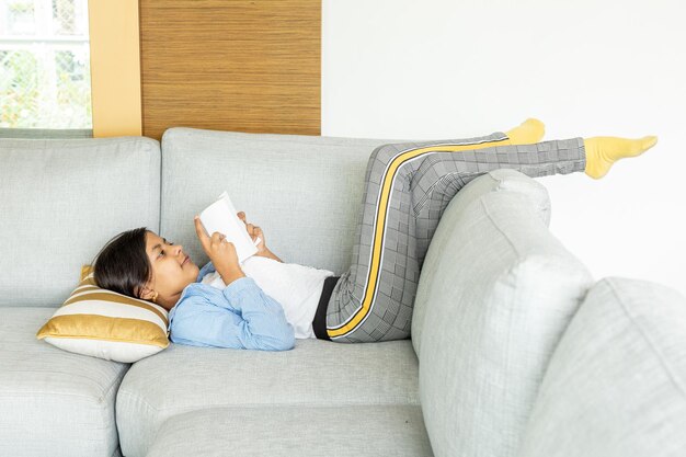 Young teenage girl is reading a book