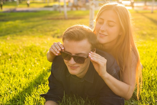 Young teenager couple have fun in a meadow.