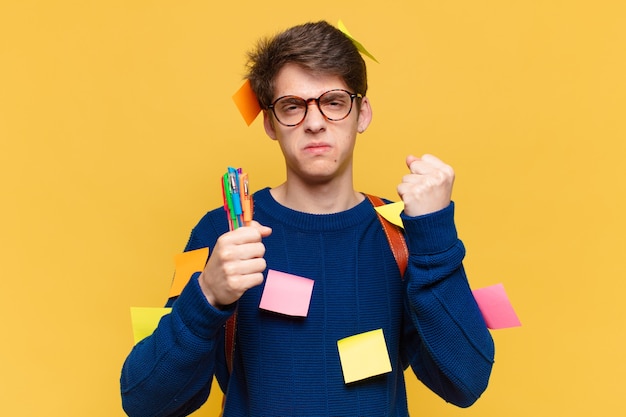 young teenager man angry expression. university student concept