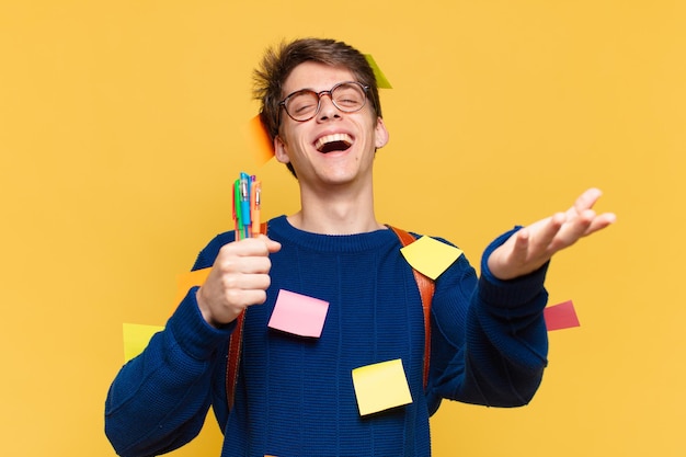 Young teenager man happy expression. university student concept