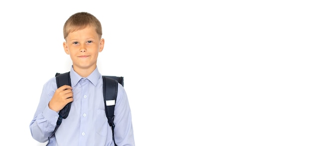 Young teenager with school backpack on white surface