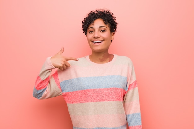 Young teenager woman person pointing by hand to herself