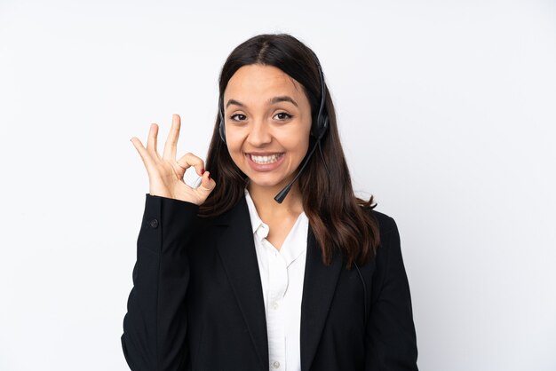 Young telemarketer woman isolated on white showing ok sign with fingers