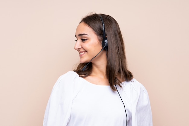 Young telemarketer woman looking side