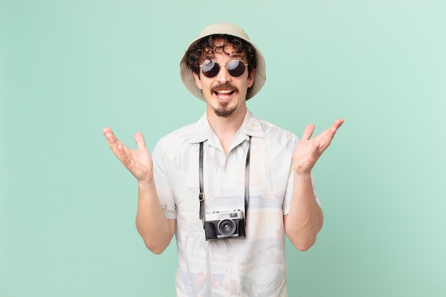 Young tourist feeling happy and astonished at something unbelievable