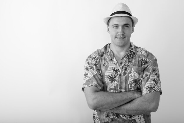 young tourist man wearing Hawaiian shirt ready for vacation. Black and white photo