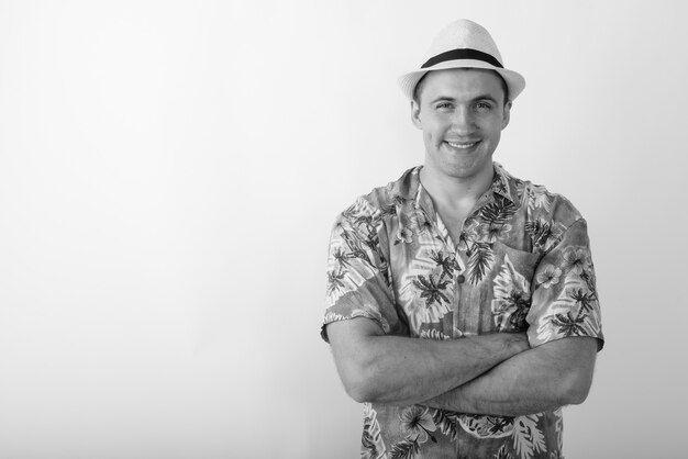 young tourist man wearing Hawaiian shirt ready for vacation. Black and white photo