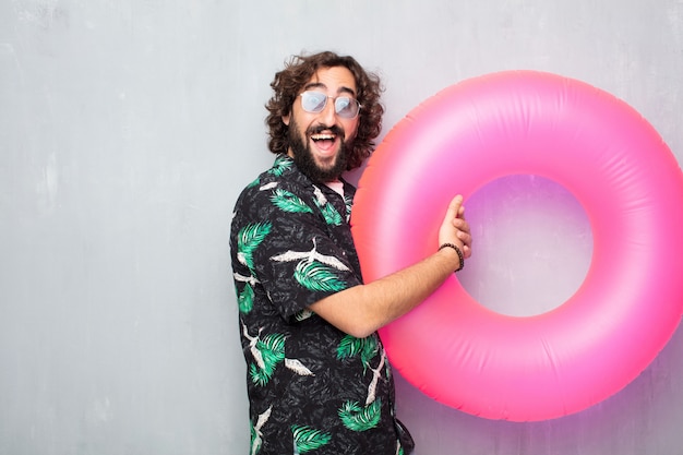 Young tourist man with a float