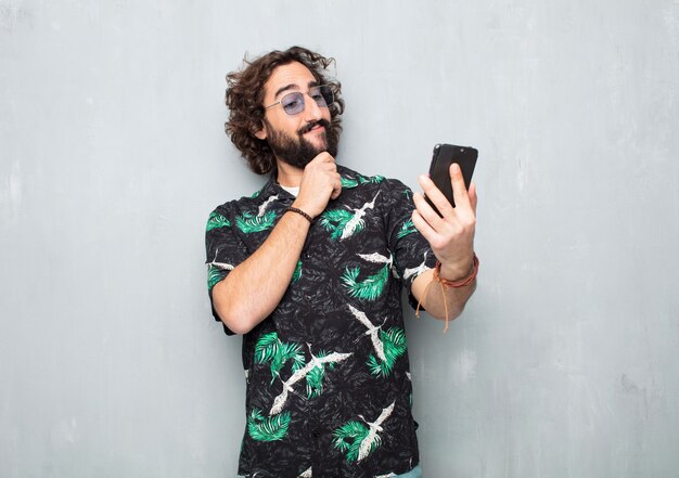 Young tourist man with a mobile phone