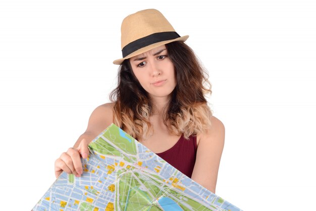 Young tourist woman looking at map.