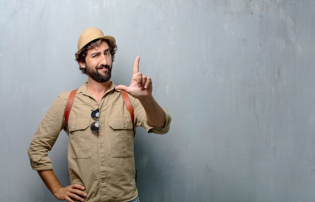 Young traveler man or tourist gesturing 