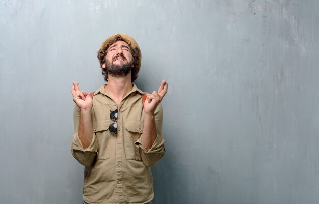 Young traveler man or tourist smiling mischeviously 