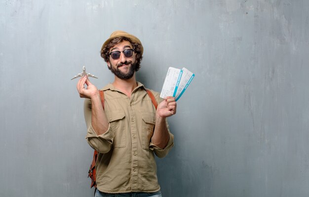 Young traveler man with a map and leather bag