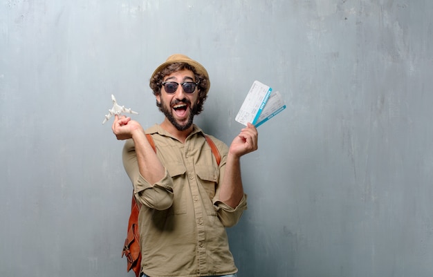 Young traveler man with a map and leather bag