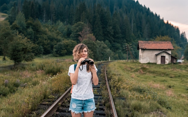 Young traveler woman on a railway