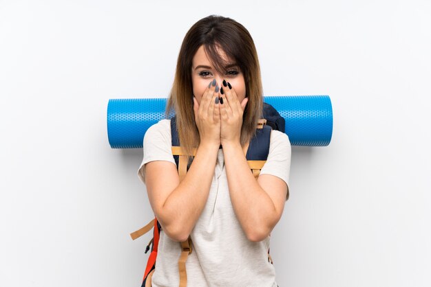 Young traveler woman over white with surprise facial expression