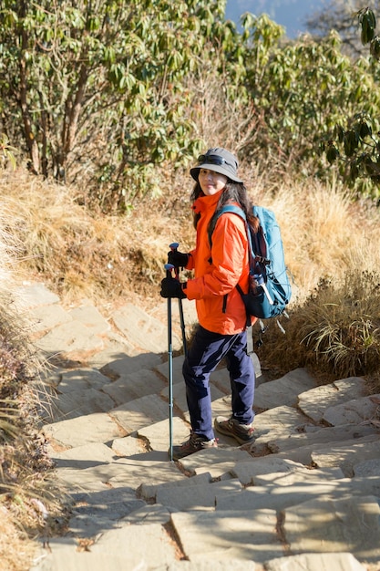 A young traveller trekking on forest trail Nepal