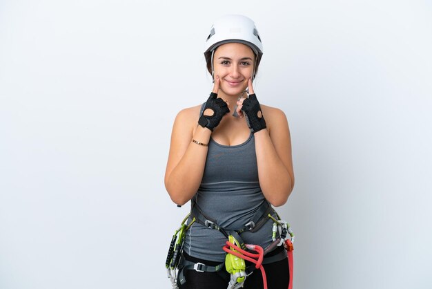 Young Ukrainian rock climber woman isolated on white background smiling with a happy and pleasant expression