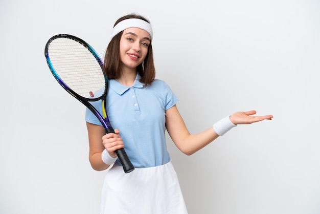 Young Ukrainian tennis player woman isolated on white background extending hands to the side for inviting to come