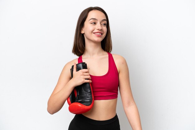 Young Ukrainian woman isolated on white background with boxing gloves