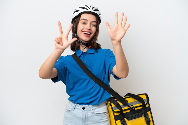 Young Ukrainian woman with thermal backpack isolated on white background counting eight with fingers
