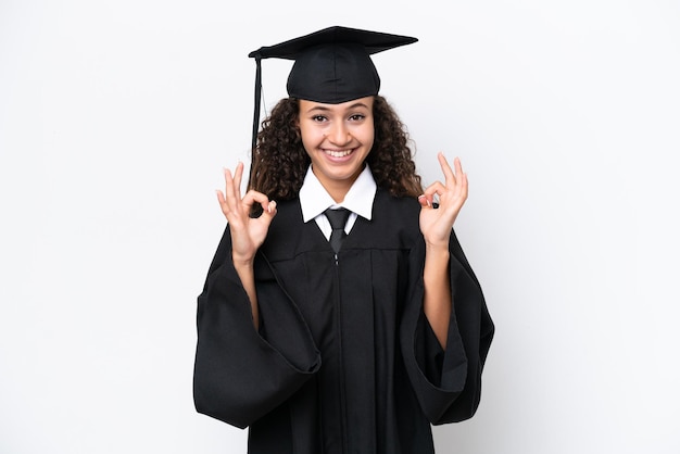 Young university graduate Arab woman isolated on white background showing an ok sign with fingers