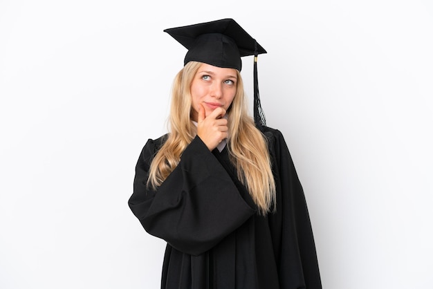 Young university graduate caucasian woman isolated on white background having doubts and with confuse face expression