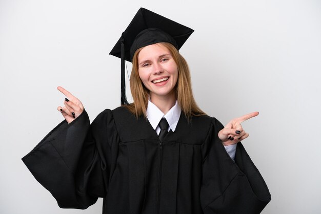Young university graduate english woman isolated on white\
background pointing finger to the laterals and happy