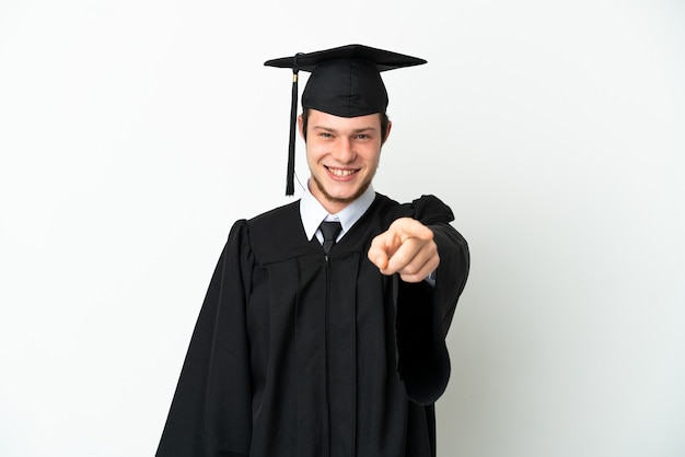 Young university Russian graduate isolated on white background pointing front with happy expression