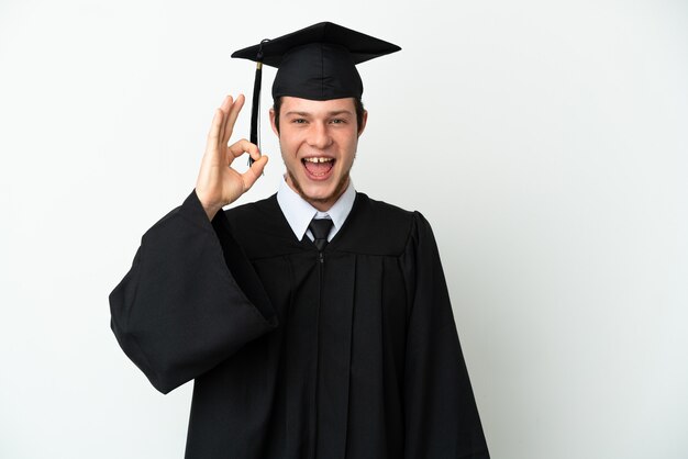 Young university Russian graduate isolated on white background showing ok sign with fingers