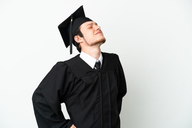 Young university Russian graduate isolated on white background suffering from backache for having made an effort