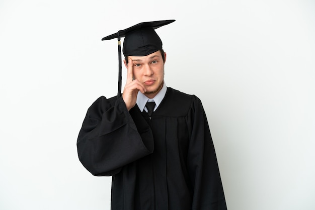 Young university Russian graduate isolated on white background thinking an idea