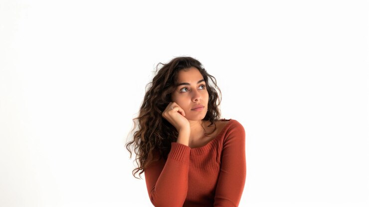 Young Uruguayan woman over isolated white background looking far away with hand to look something
