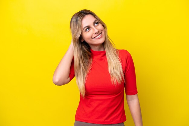 Young Uruguayan woman isolated on yellow background thinking an idea