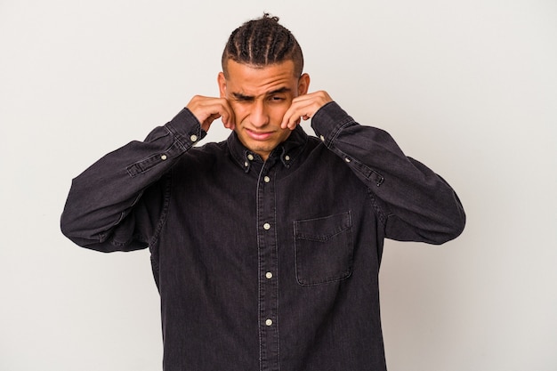 Young venezuelan man isolated on white background whining and crying disconsolately.