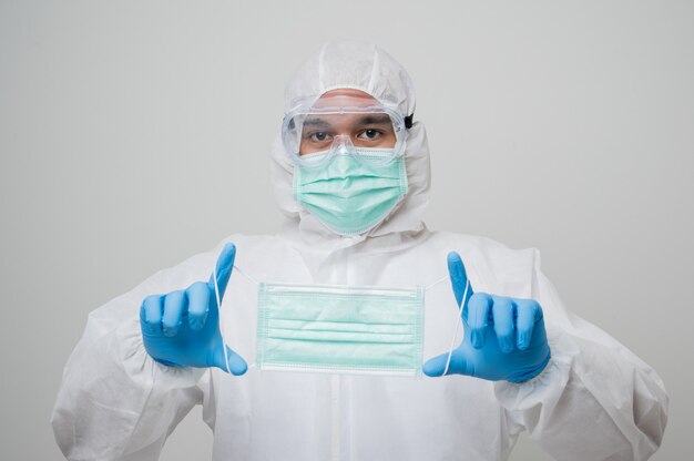 Young virologist wearing a protective suit