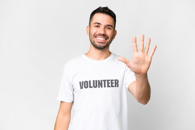 Young volunteer caucasian man over isolated white background counting five with fingers