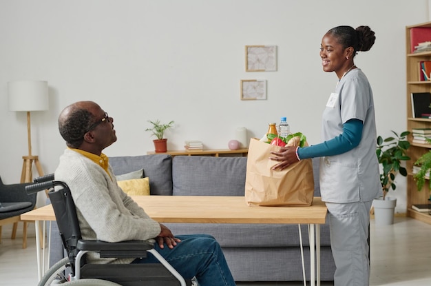 Young volunteer delivering food for senior people