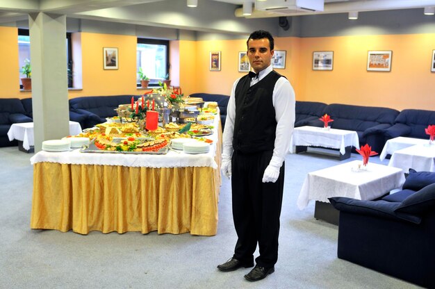 Young waiter in reataurant