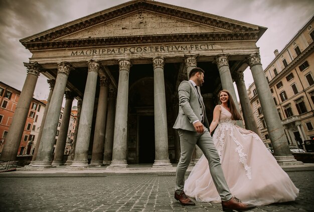 Young wedding couple by Pantheon in Rome, Italy