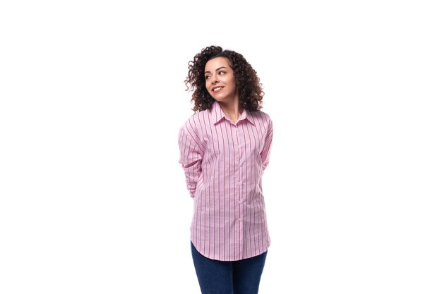 Young wellgroomed brunette woman in pink shirt isolated on white background