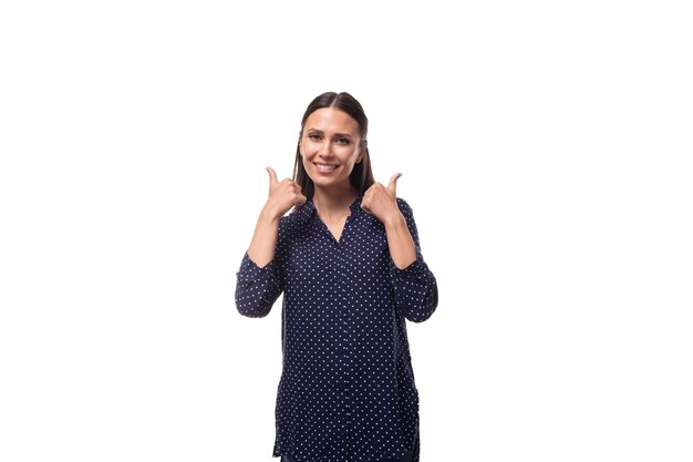 Young wellgroomed confident successful woman with black hair is dressed in a blue blouse