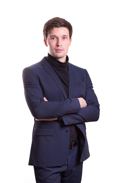 Young white handsome man in a shirt strict office suit stands isolated on a white background