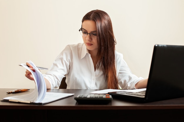 Young woman accountant at workplace concept