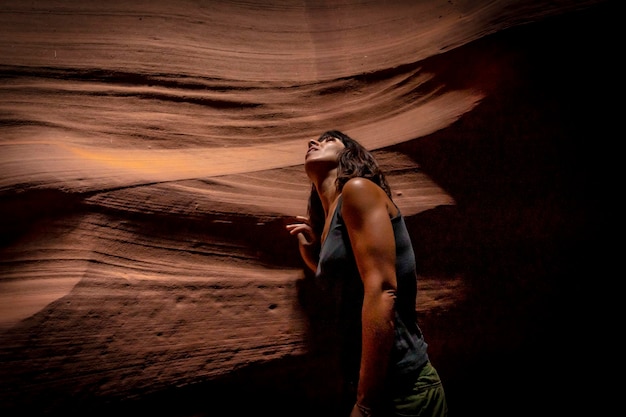 A young woman admiring the beauty of the Upper Antelope Canyon in the town of Page Arizona